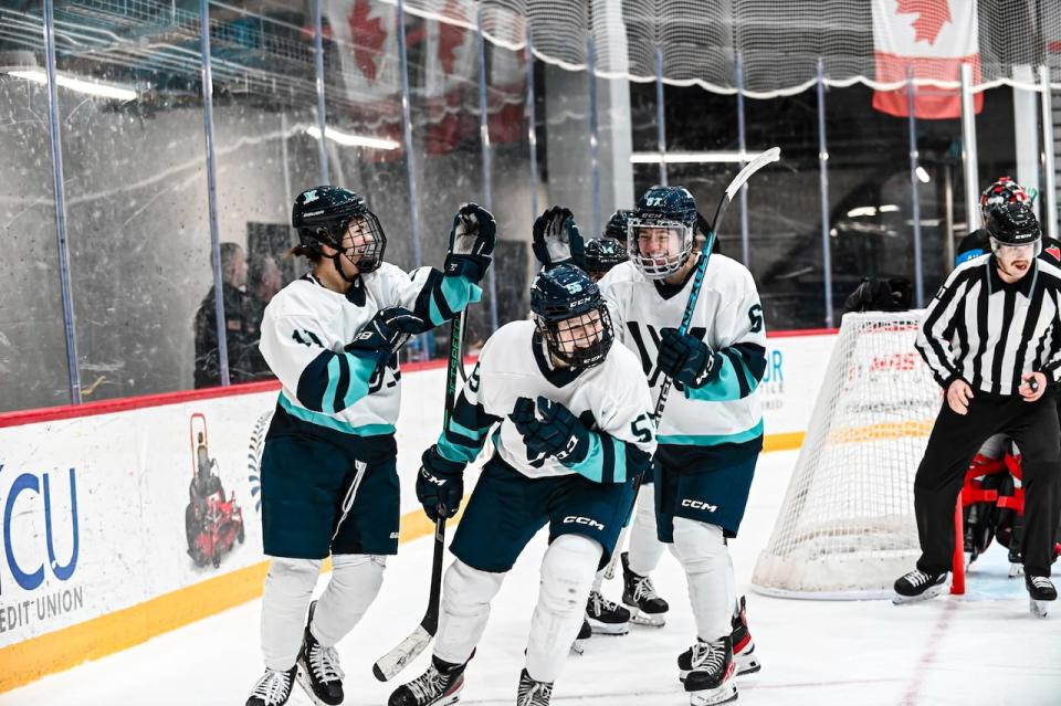 PWHL New York forward Jessie Eldridge (55) celebrates a goal with her teammates.