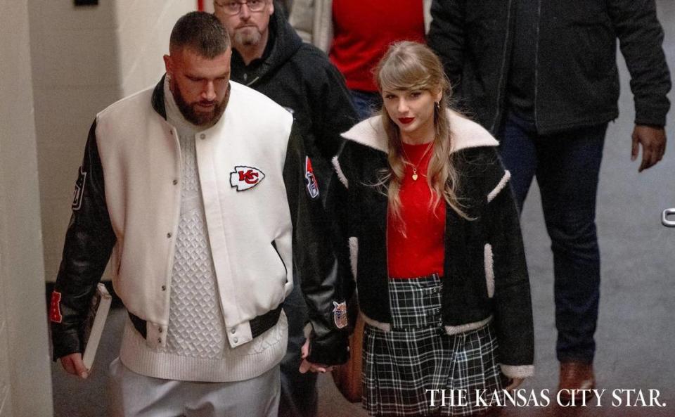 Pop star Taylor Swift holds hands with boyfriend and Kansas City Chiefs tight end Travis Kelce as they leave Arrowhead Stadium after an NFL football game on Monday, Dec. 25, 2023, in Kansas City.