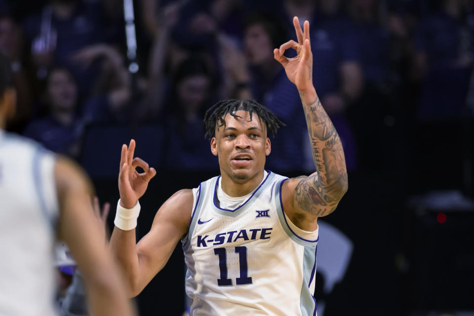 FILE - Kansas State forward Keyontae Johnson celebrates a 3-point basket against Oklahoma during the first half of an NCAA college basketball game in Manhattan, Kan., Wednesday, March 1, 2023. Keyontae Johnson was named to The Associated Press All-Big 12 team in voting released Tuesday, Mar 7, 2023. (AP Photo/Reed Hoffmann, File)