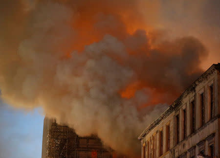 Firefighters attend to a blaze at the Mackintosh Building at the Glasgow School of Art, which is the second time in four years, Glasgow, Scotland, Britain, June 16, 2018. REUTERS/Russell Cheyne