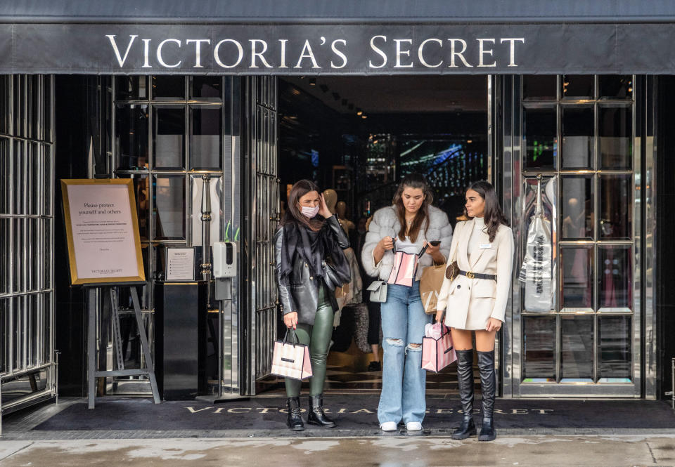 Women standing outside a Victoria's Secret store