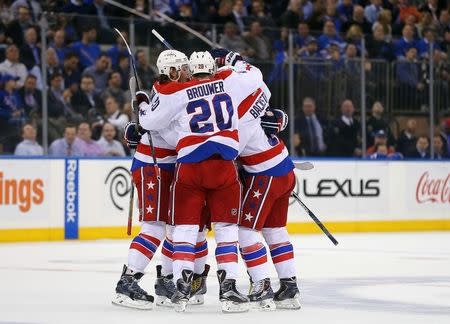 Apr 30, 2015; New York, NY, USA; Washington Capitals left wing Alex Ovechkin (8) is congratulated by teammates after scoring against the New York Rangers during the first period in game one of the second round of the 2015 Stanley Cup Playoffs at Madison Square Garden. Mandatory Credit: Adam Hunger-USA TODAY Sports