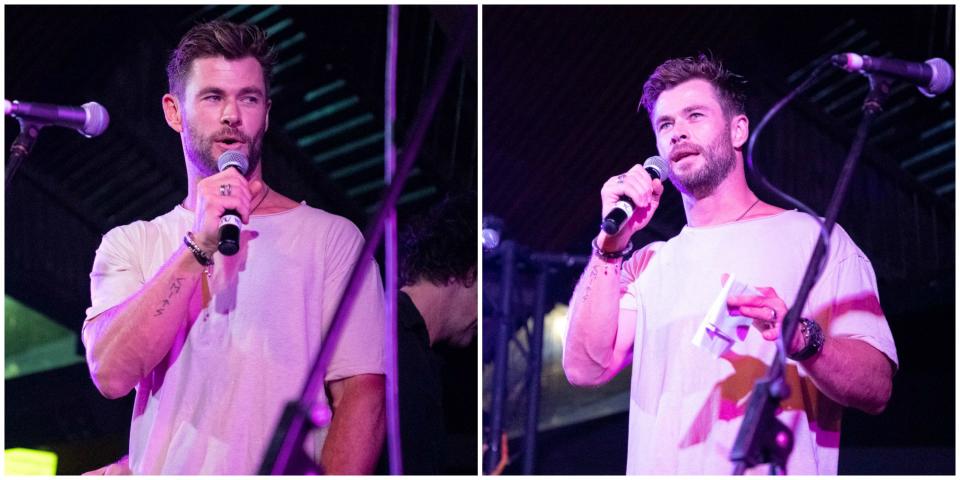 Chris Hemsworth in a white T-shirt on stage in Byron Bay