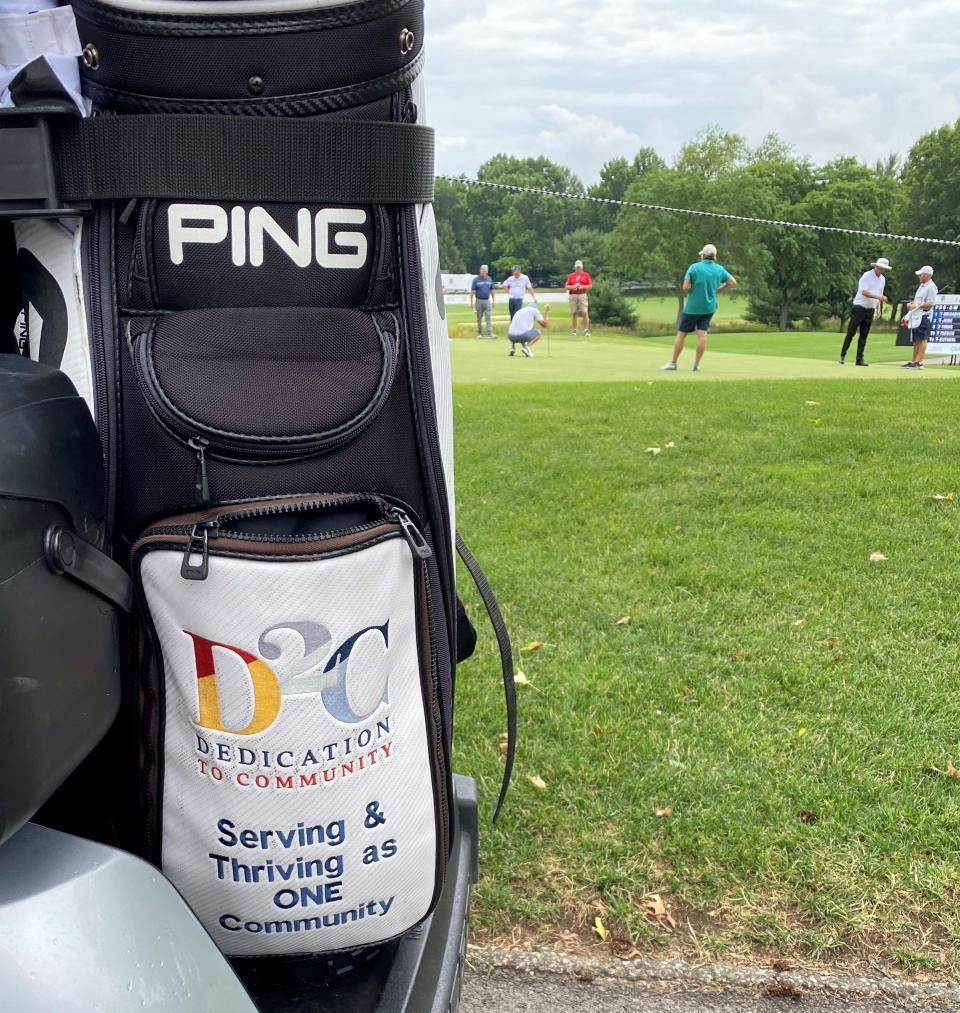 PGA Tour Champions player Kirk Triplett's golf bag displays his partnership with Dedication To Community (D2C), a national non-profit. Triplett is participating in the 2022 Bridgestone Senior Players Championship at Firestone Country Club in Akron, Ohio.