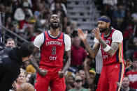 New Orleans Pelicans forward Naji Marshall (8) reacts with forward Brandon Ingram after a turnover in the second half of an NBA basketball play-in tournament game against the Sacramento Kings in New Orleans, Friday, April 19, 2024. The Pelicans won 105-98. (AP Photo/Gerald Herbert)