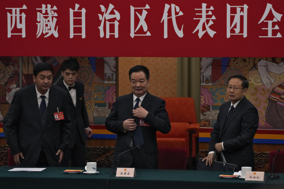 Wang Junzheng, Communist Party Secretary for western China's Tibet Autonomous Region, centre, and his delegates prepare to leave after attending a deliberation on the government work report, on the sideline of the National People's Congress at the Great Hall of the People in Beijing, Wednesday, March 6, 2024. This year, China's national legislature resumed its annual in-person meetings in a way that it hadn't done since before the pandemic. Though officials say China is back to business, in practice, the meetings have become even more tightly scripted to broadcast Chinese leader Xi Jinping's message, leaving little room for the spontaneity and open engagement the sessions once offered before COVID-19.(AP Photo/Andy Wong, File)