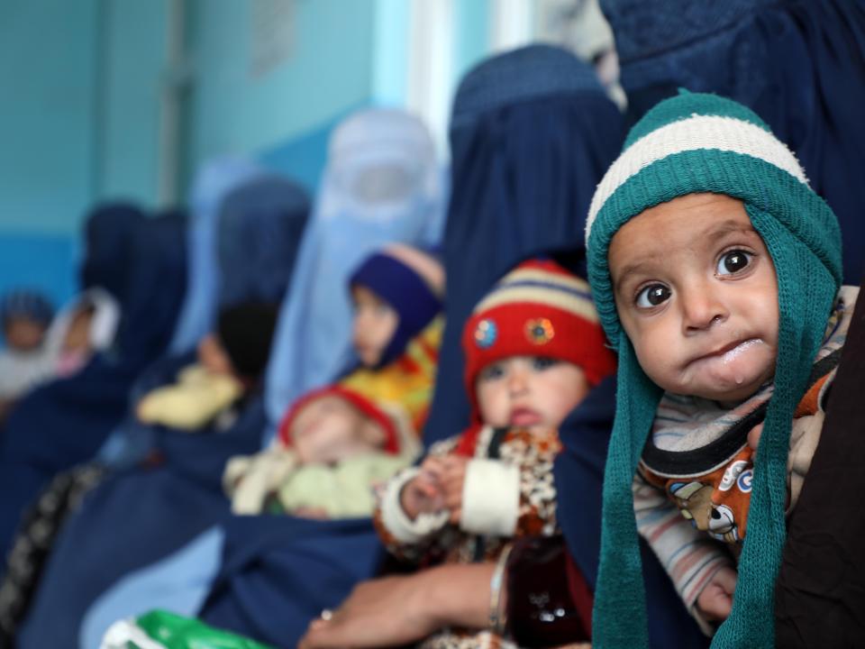 Afghan children are seen with their mothers in Kabul, Afghanistan on January 16, 2022. In Afghanistan, children cannot stand on their feet despite their age; the reason is simply hunger.