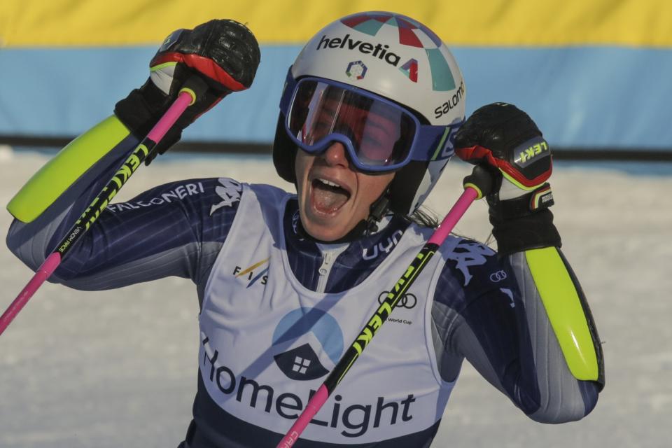 Italy's Marta Bassino celebrates in the finish area after winning an alpine ski, women's World Cup giant slalom in Killington, Vt., Saturday, Nov. 30, 2019. (AP Photo/Charles Krupa)