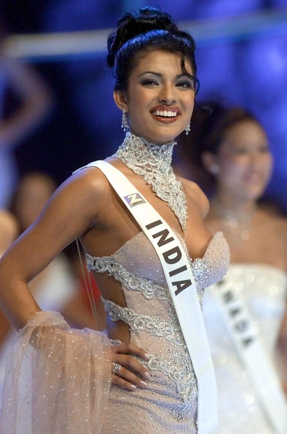 18 year old Priyanka Chopra of India poses on stage during the Miss World final at the Millenium Dome in London, 30 November 2000 (AFP via Getty Images)