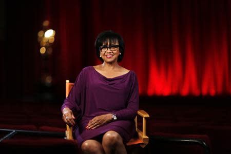 Academy President Cheryl Boone Isaacs poses for a portrait inside the The Samuel Goldwyn theatre at the Academy of Motion Picture Arts and Sciences in Beverly Hills, California February 19, 2014. REUTERS/Mario Anzuoni