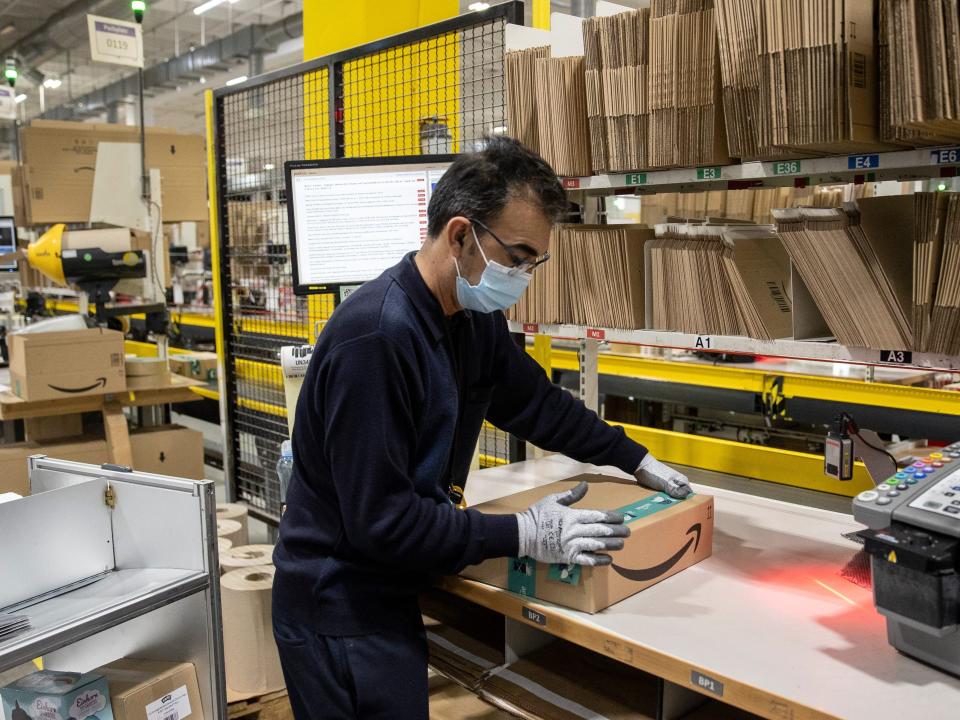 A packing station inside an Amazon warehouse in Germany.