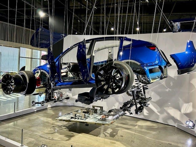 Visitors to the Petersen Automotive Museum can see the assembly of a Tesla at the "Inside Tesla, Supercharging the Electric Revolution" exhibit.