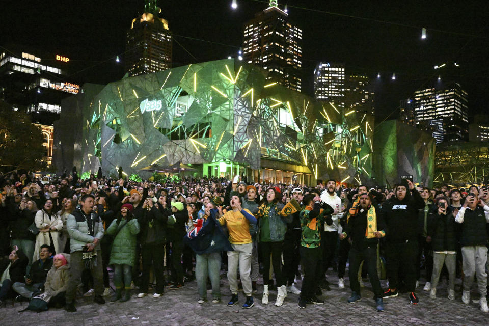 Australia supporters watch a live screening of the Women's World Cup semifinal soccer match between Australia and England at Stadium Australia in Sydney, as they gather at Federation Square in Melbourne, Australia, Wednesday, Aug. 16, 2023. (Joel Carrett/AAP Image via AP)