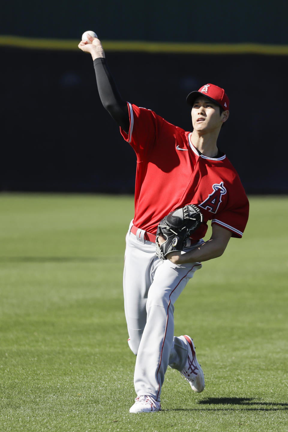 Los Angeles Angels' Shohei Ohtani throws during spring training baseball practice, Wednesday, Feb. 12, 2020, in Tempe, Ariz. (AP Photo/Darron Cummings)