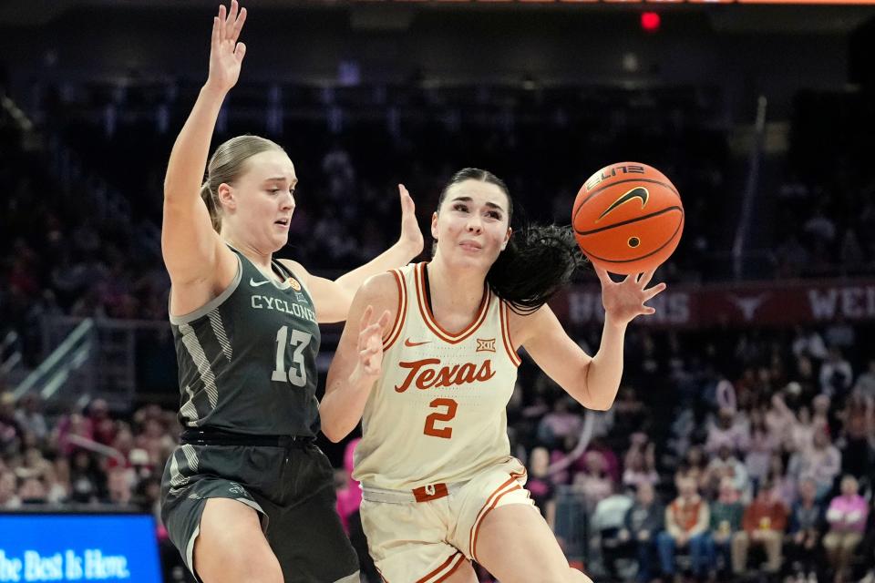 Texas guard Shaylee Gonzales (2) drives around Iowa State guard Hannah Belanger (13) on Saturday. The Cyclones dropped the game in Austin to fall to 14-10 on the season.