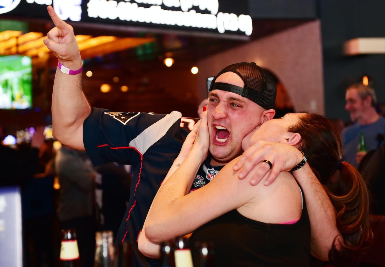 Fans celebrate at the William Hill Sports Book in Atlantic City, N.J. <a href="https://www.gettyimages.com/detail/news-photo/fans-gather-at-william-hill-sports-book-at-ocean-resort-news-photo/1127223046?phrase=sports%20book%20new%20jersey&adppopup=true" rel="nofollow noopener" target="_blank" data-ylk="slk:Lisa Lake/Getty Images for William Hill US;elm:context_link;itc:0;sec:content-canvas" class="link ">Lisa Lake/Getty Images for William Hill US</a>