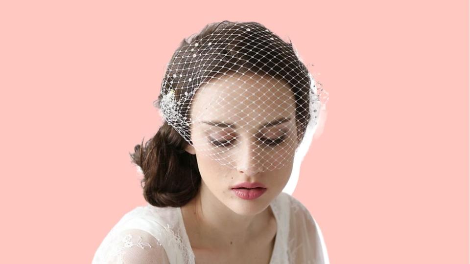 Go with this bird cage veil from Twigs & Honey.