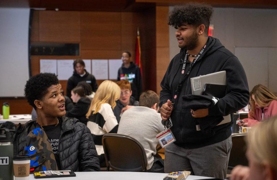 Kenon Lofton, 17, left, a student at University Academy, talks with DJ Yearwood, a youth advocate, who spoke the about KC Youth and Young Adult Commissions for the City of Kansas City during a student event with American Public Square on Wednesday, Feb. 28, 2024, at the Central Library in Downtown Kansas City. The event was a recruiting event for Yearwood who would like to get more young adults involved in civic engagement. Tammy Ljungblad/tljungblad@kcstar.com