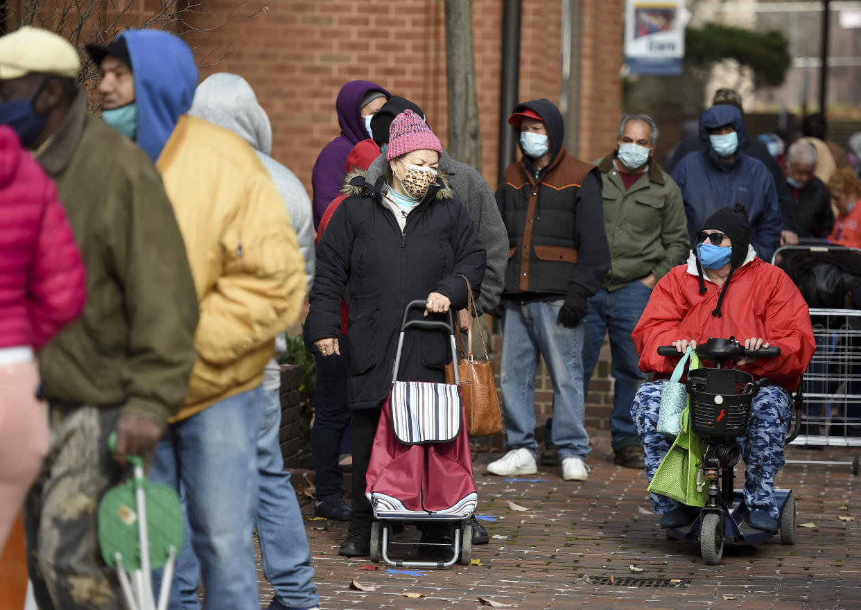 Reading, PA - November 23: People wait in line to get turkeys. During the distribution for the Annual Alvernia University Turkey Drive Monday morning November 23, 2020 at their new downtown College Towne Location on Penn Street in Reading. (Photo by Ben Hasty/MediaNews Group/Reading Eagle via Getty Images)