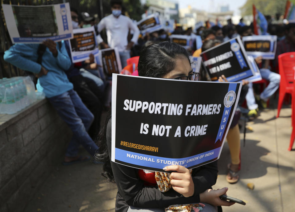 FILE - In this Feb. 16, 2021, file photo, students hold placards demanding the release of Indian climate activist Disha Ravi, during a protest in Bengaluru, India. Ravi, 22, was arrested in Bengaluru Saturday for circulating a document on social media supporting months of massive protests by farmers. Police said that the document spread misinformation about the farmer protests on the outskirts of New Delhi and "tarnished the image of India." (AP Photo/Aijaz Rahi, File)