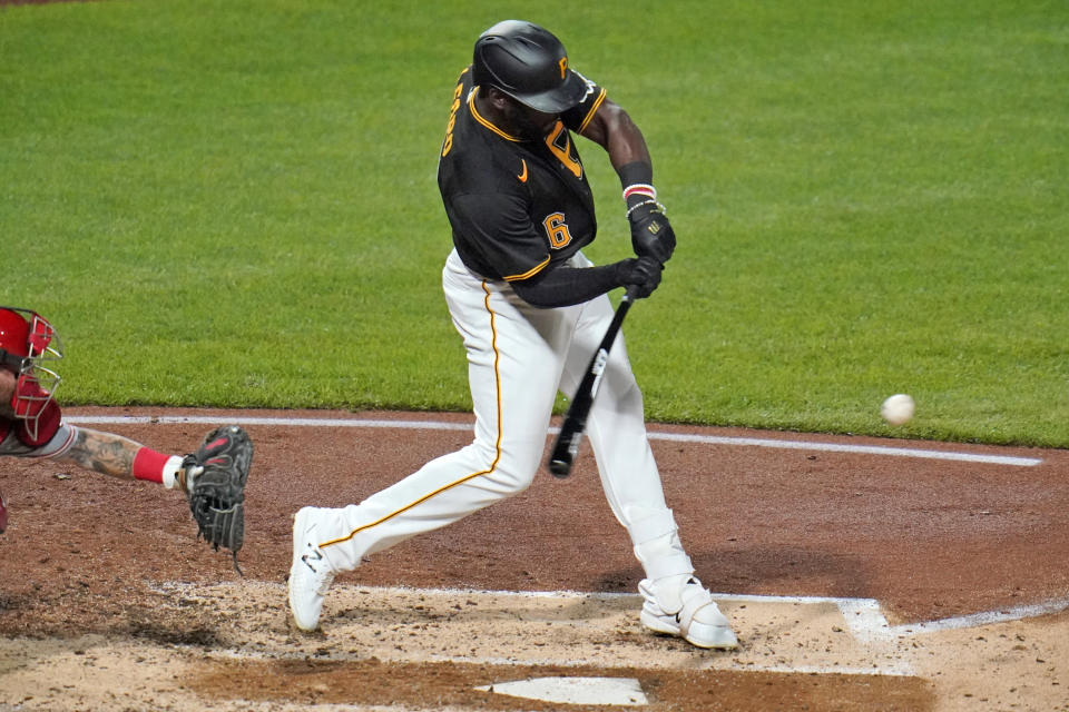 Pittsburgh Pirates' Anthony Alford swings for a triple off Cincinnati Reds starting pitcher Trevor Bauer that drove in two runs during the fourth inning of the second baseball game of a doubleheader in Pittsburgh, Friday, Sept. 4, 2020. (AP Photo/Gene J. Puskar)