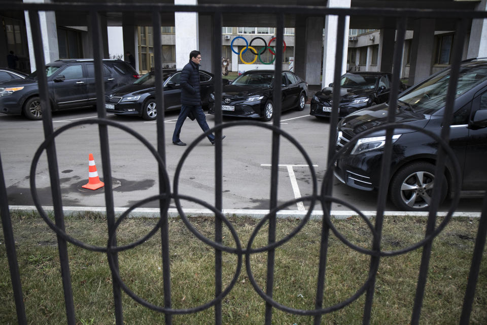 Four-time Olympic champion Alexander Popov walks in the yard of the Russian Olympic Committee building in Moscow, Russia, Monday, Dec. 9, 2019. The World Anti-Doping Agency has banned Russia from the Olympics and other major sporting events for four years, though many athletes will likely be allowed to compete as neutral athletes. (AP Photo/Pavel Golovkin)