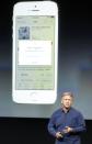 Phil Schiller, senior vice president of worldwide marketing for Apple Inc, talks about the new iPhone 5S Touch ID fingerprint recognition feature at Apple Inc's media event in Cupertino, California September 10, 2013. REUTERS/Stephen Lam (UNITED STATES - Tags: BUSINESS SCIENCE TECHNOLOGY BUSINESS TELECOMS)