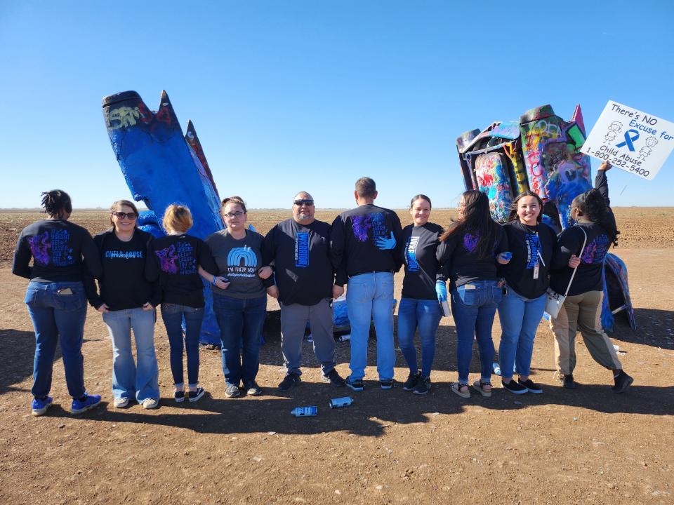 Texas Department of Family Protective Services and Saint Francis Ministries Paint the Cadillac Ranch Blue Wednesday to spread awareness for Child Abuse Prevention month.