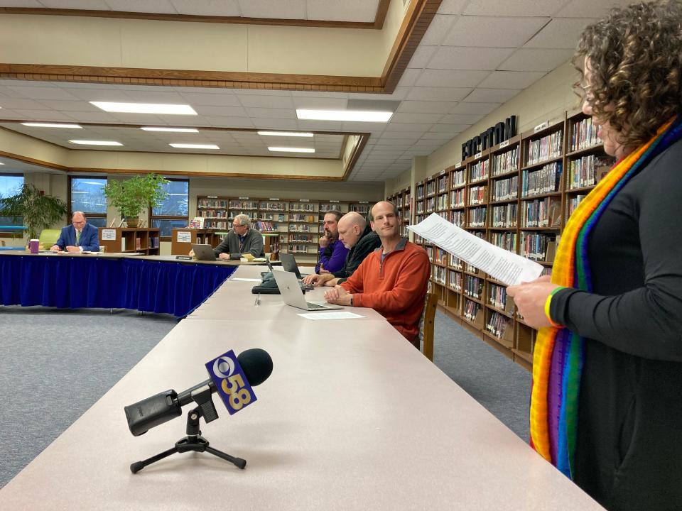 Sheboygan Falls School District board member Edward Brey looks on as Reverend Kristal Klemme, a Falls resident and clergy of the United Church of Christ, speaks in support of LGBTQ students at the school board meeting April 3, 2023. "What I read in the report invited me to be curious about the fear many folks have when they don’t understand something," Klemme said.