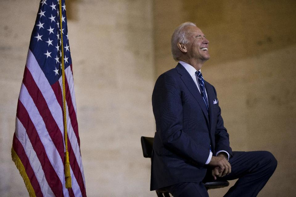 Vice President Joe Biden smiles as he listens to remarks at a news conference, Thursday, Feb. 6, 2014, at 30th Street Station in Philadelphia. Biden in his visit to the train station stressed the need for infrastructure investment. (AP Photo/Matt Rourke)