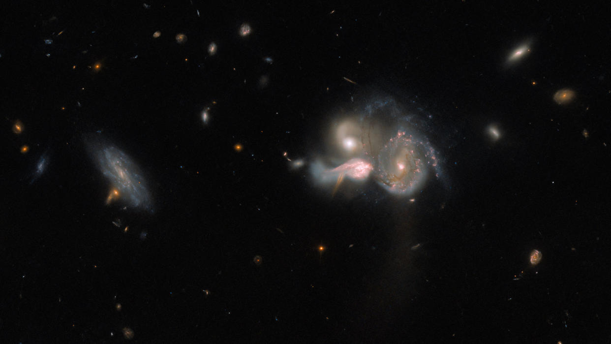  A Hubble image showing three galaxies in the constellation Bo?tes heading for a violent collision that will birth a new galaxy.  