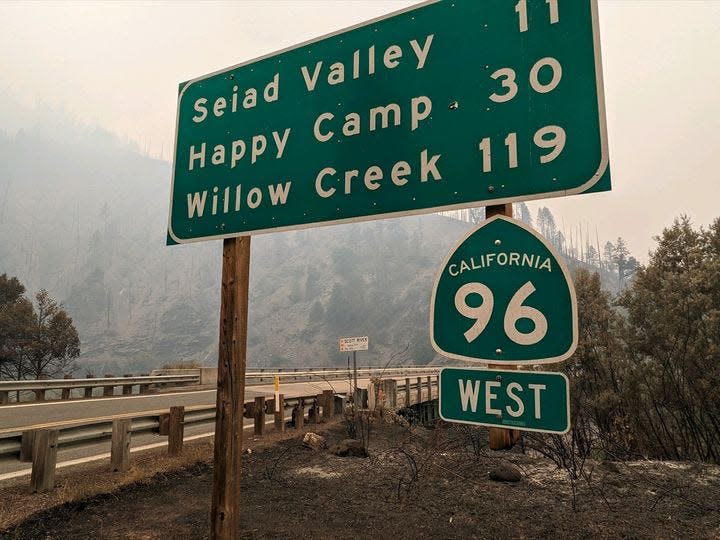 Smoke from fires burning in the Klamath National Forest fills the air along a closed stretch of Highway 96 in Siskiyou County on Thursday, Aug. 17, 2023