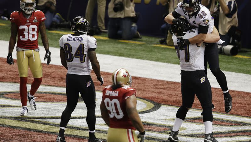 Baltimore Ravens tight end Dennis Pitta (88) celebrates with center Matt Birk after his 1-yard touchdown reception on a throw from quarterback Joe Flacco against the San Francisco 49ers during Super Bowl XLVII, Feb. 3, 2013, in New Orleans. 