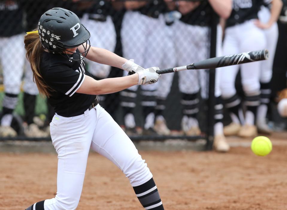 Perry's Marlee Pireu, 3, makes contract with the ball during a game against Green. Wednesday, March 30, 2022.