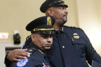 U.S. Capitol Police Sgt. Aquilino Gonell left, and U.S. Capitol Police Sgt. Harry Dunn stand after the House select committee hearing on the Jan. 6 attack on Capitol Hill in Washington, Tuesday, July 27, 2021. (AP Photo/ Andrew Harnik, Pool)