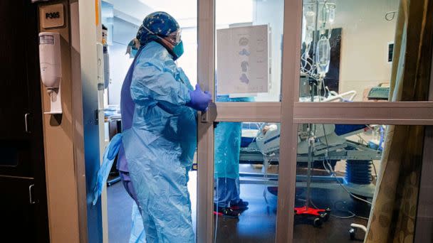 PHOTO: A nurse enters a room in the COVID ICU to administer treatment to a patient at SSM Health St. Anthony Hospital in Oklahoma City, on Aug. 5, 2022.<p>covid (Chris Landsberger/The Oklahoman via USA Today Network, FILE)