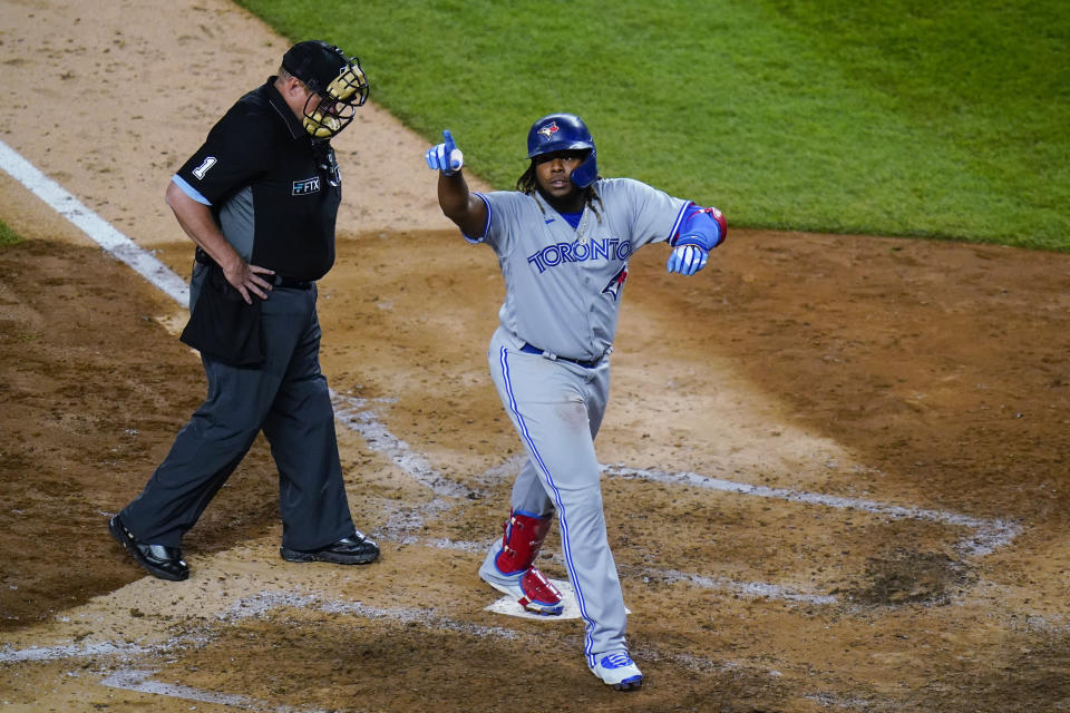 Toronto Blue Jays&#39; Vladimir Guerrero Jr. gestures to fans as he reaches home plate on a home run during the eighth inning of the team&#39;s baseball game against the New York Yankees on Wednesday, April 13, 2022, in New York. (AP Photo/Frank Franklin II)