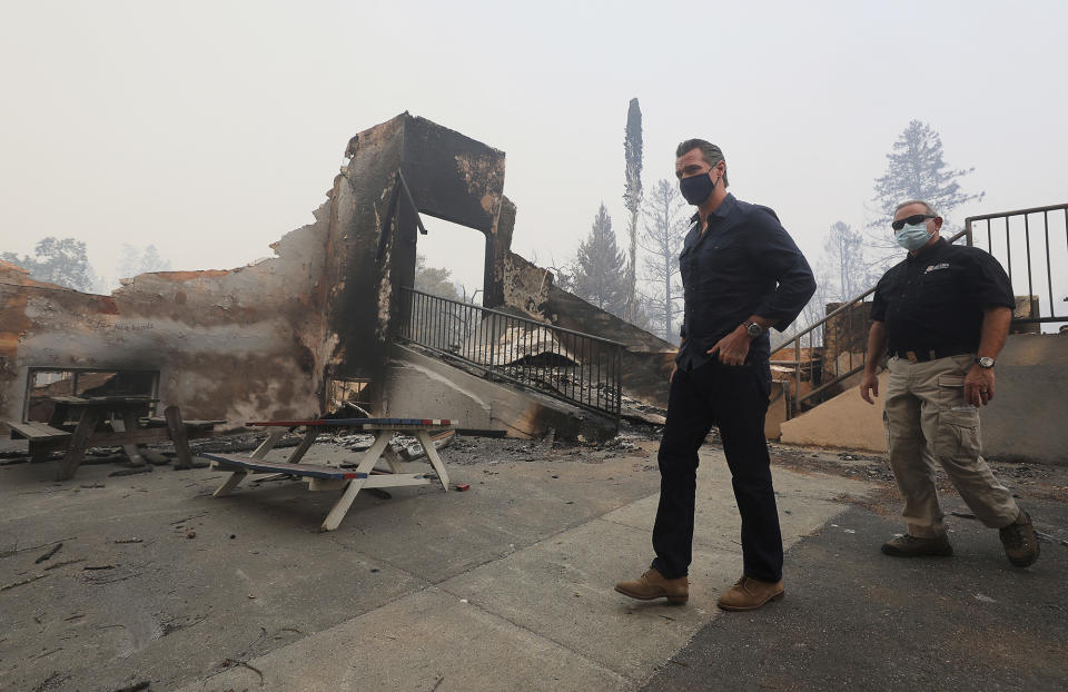 California Governor Gavin Newsom arrives at Foothills Elementary School while touring areas damaged by the Glass Fire near St. Helena, Calif., Thursday, Oct. 1, 2020. (Christopher Chung/The Press Democrat via AP, Pool)