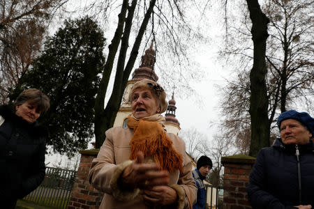 Parishioners speak to Reuters after leaving the mass at the church in Kalinowka, Poland November 25, 2018. REUTERS/Kacper Pempel/Files