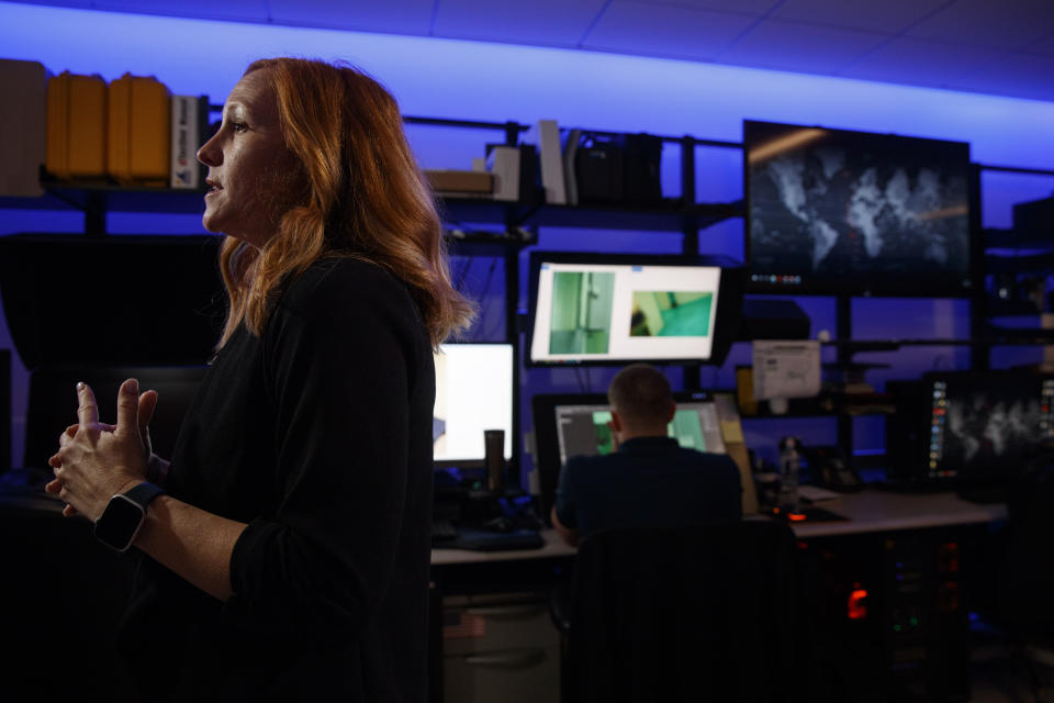 Erin Burke, left, Section Chief of the Child Exploitation Investigations Unit at Homeland Security, is interviewed inside the Victim Identification Lab, part of Homeland Security's Child Exploitation Investigations Unit, in Fairfax, Va., Friday, Nov. 22, 2019. The Homeland Security Investigations section's little-known Child Exploitation Investigations lab is where agents scour disturbing photos and videos of child sexual abuse. They look for unlikely clues that help them identify the children and bring their abusers to justice. In one case, it was the loud, persistent chirping of a bird. Another time, it was unusual playground equipment. (AP Photo/Jacquelyn Martin)