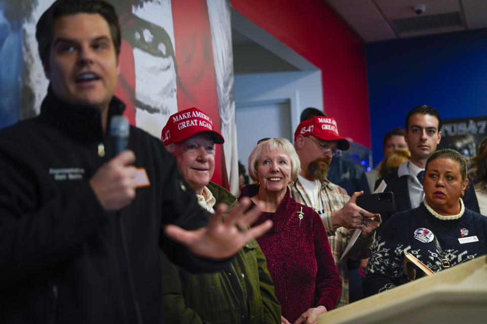 Supporters listening to Rep. Matt Gaetz, R-Fla., left, during a campaign stop at Team Trump New Hampshire headquarters, Sunday, Jan. 21, 2024, in Manchester, NH. (AP Photo/Pablo Martinez Monsivais)