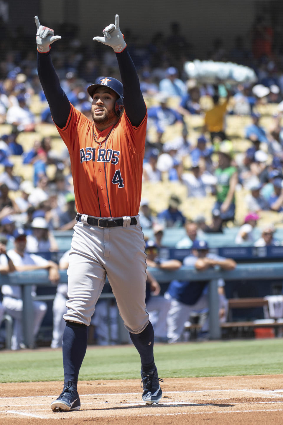 Houston Astros' George Springer celebrates his solo home run during the first inning of a baseball game against the Los Angeles Dodgers in Los Angeles, Sunday, Aug. 5, 2018. (AP Photo/Kyusung Gong)