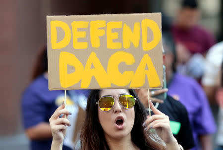 FILE PHOTO: Yessenia Lopez stands with supporters of the Deferred Action for Childhood Arrivals (DACA) program recipient during a rally outside the Federal Building in Los Angeles, California, U.S., September 1, 2017. REUTERS/Kyle Grillot