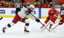 Columbus Blue Jackets center Max Domi (16) takes a shot on goal against Detroit Red Wings right wing Bobby Ryan (54) during the third period of an NHL hockey game Tuesday, Jan. 19, 2021, in Detroit. (AP Photo/Duane Burleson)