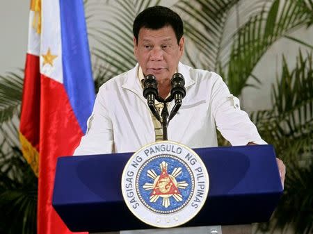 Philippines' President Rodrigo Duterte delivers his pre-departure message before leaving for the Association of Southeast Asian Nations (ASEAN) Summit in Laos at the Davao International Airport in Davao city, Philippines September 5, 2016. REUTERS/Lean Daval Jr