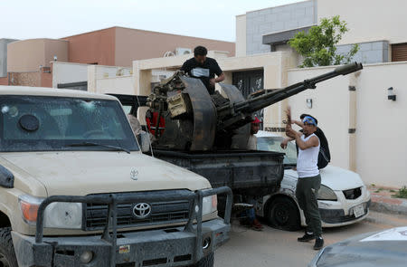 Members of the Libyan internationally recognised government forces are seen during fighting with Eastern forces in Ain Zara, Tripoli, Libya April 20, 2019. REUTERS/Hani Amara