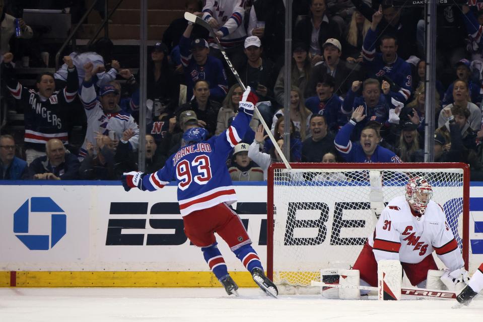 NEW YORK, NEW YORK - MAY 05: Mika Zibanejad #93 of the New York Rangers celebrates after scoring a goal against Frederik Andersen #31 of the Carolina Hurricanes during the first period in Game One of the Second Round of the 2024 Stanley Cup Playoffs at Madison Square Garden on May 05, 2024 in New York City.