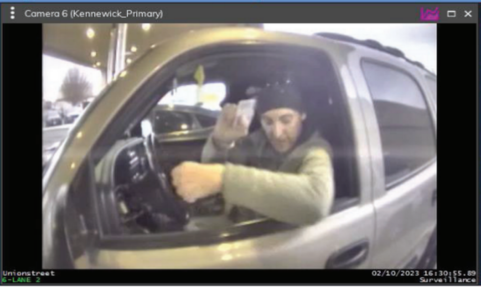Levi Dennis, a suspect in a Tri-Cities mail theft case, was caught in a Kennewick credit union security video.