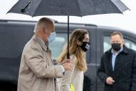 Democratic presidential candidate former Vice President Joe Biden, accompanied by his granddaughter Natalie Biden, right, boards his campaign plane at New Castle Airport in New Castle, Del., Thursday, Oct. 29, 2020, to travel to Florida for drive-in rallies. (AP Photo/Andrew Harnik)