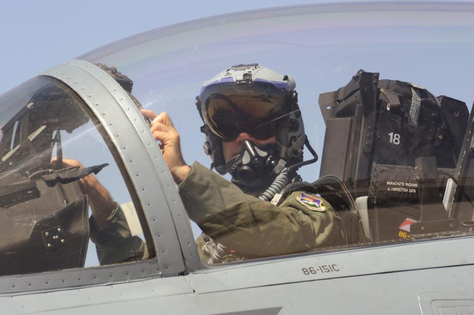 Oregon Air National Guard Lt. Col. Mark Porcella prepares for a afternoon flight at Nellis Air Force Base, Nev., in an F-15 Eagle assigned to the 142nd Fighter Wing, June 12, 2017. Over 120 Oregon Air Guardsmen are supporting the Weapons Instructor Course during their three-week duty assignment. (U.S. Air National Guard photo by Master Sgt. John Hughel, 142nd Fighter Wing Public Affairs)